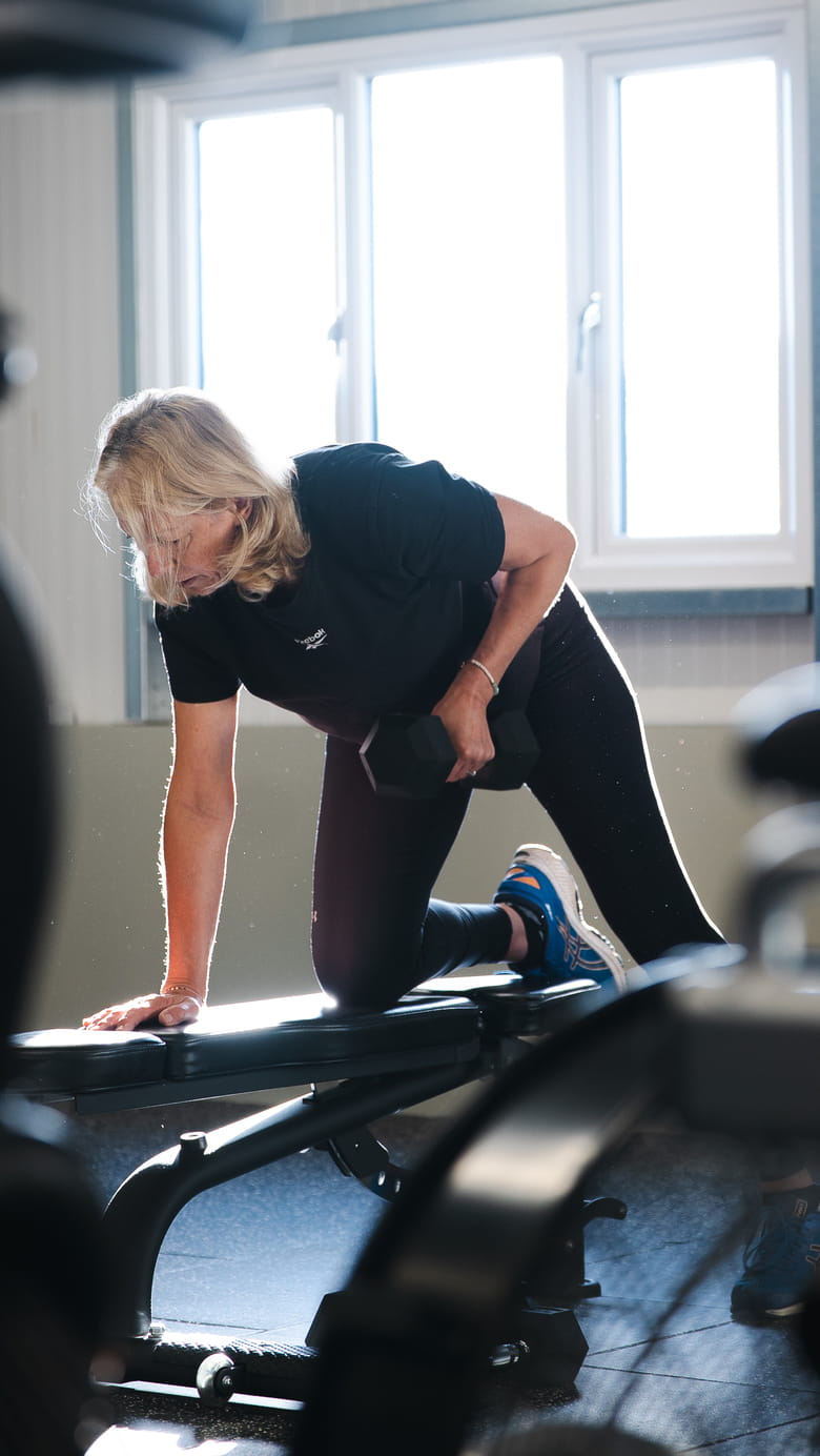 Woman working out on a workout bench